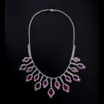 White gold, diamond and tourmaline necklace Made with 635 brilliant-cut, step and shuttle diamonds with a total estimated weight of 33 ct and 15 teardrop-shaped purple tourmalines - var. rubellite - of about 55 ct. Total weight gr. 141.86